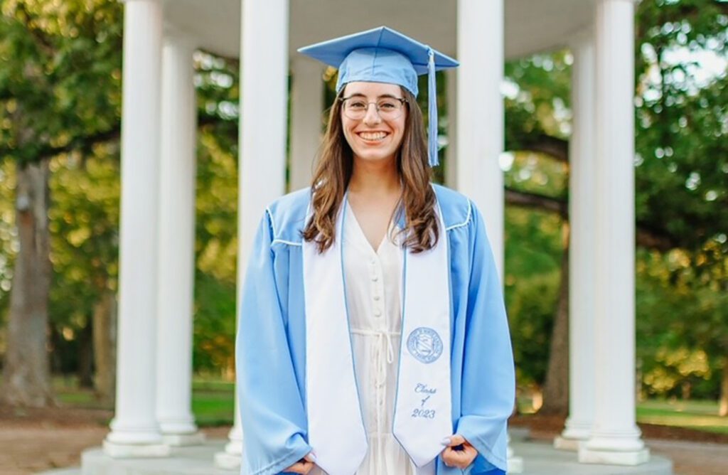 Graduate Emma Cohn poses in front of the Well.
