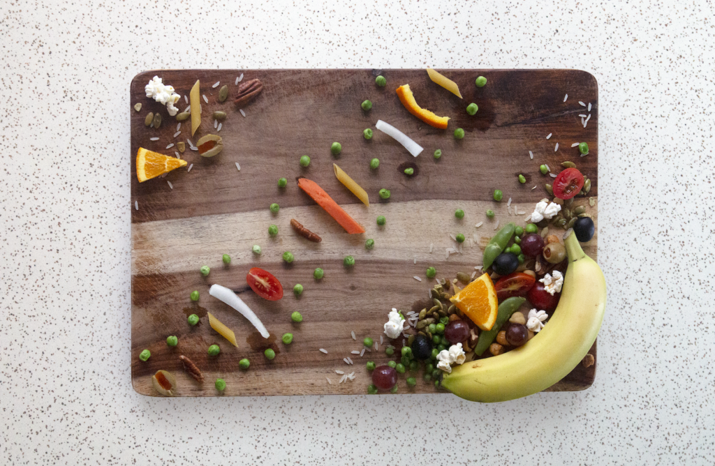 Food distributed on a cutting board.