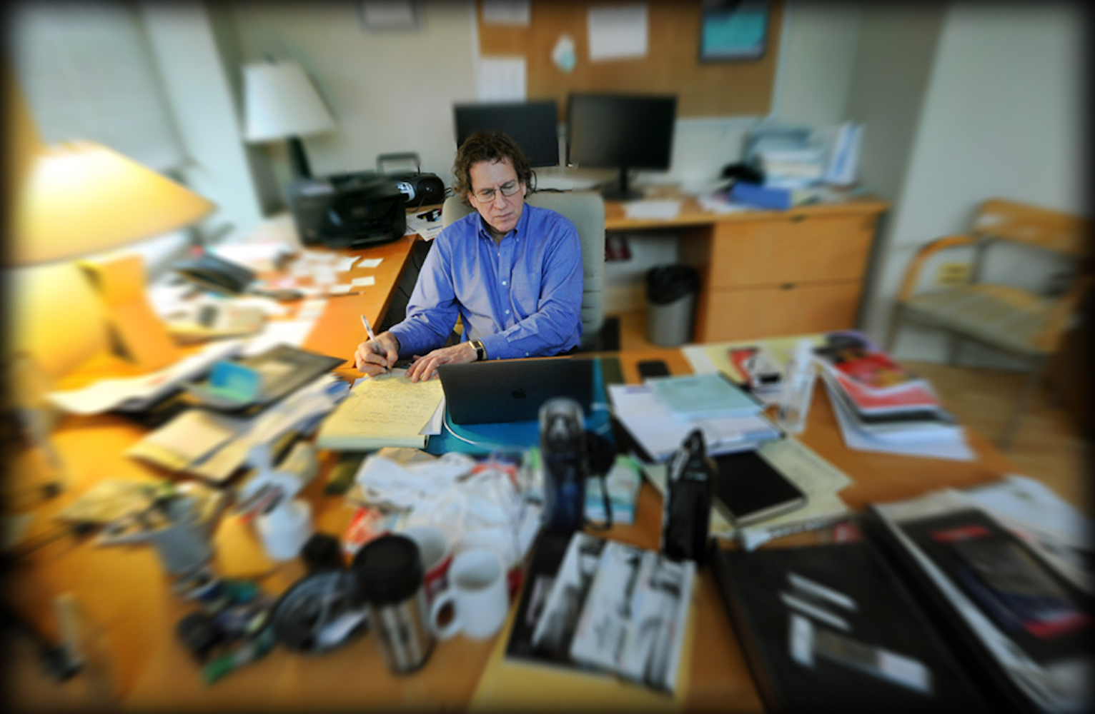 Adam Versényi works in his office