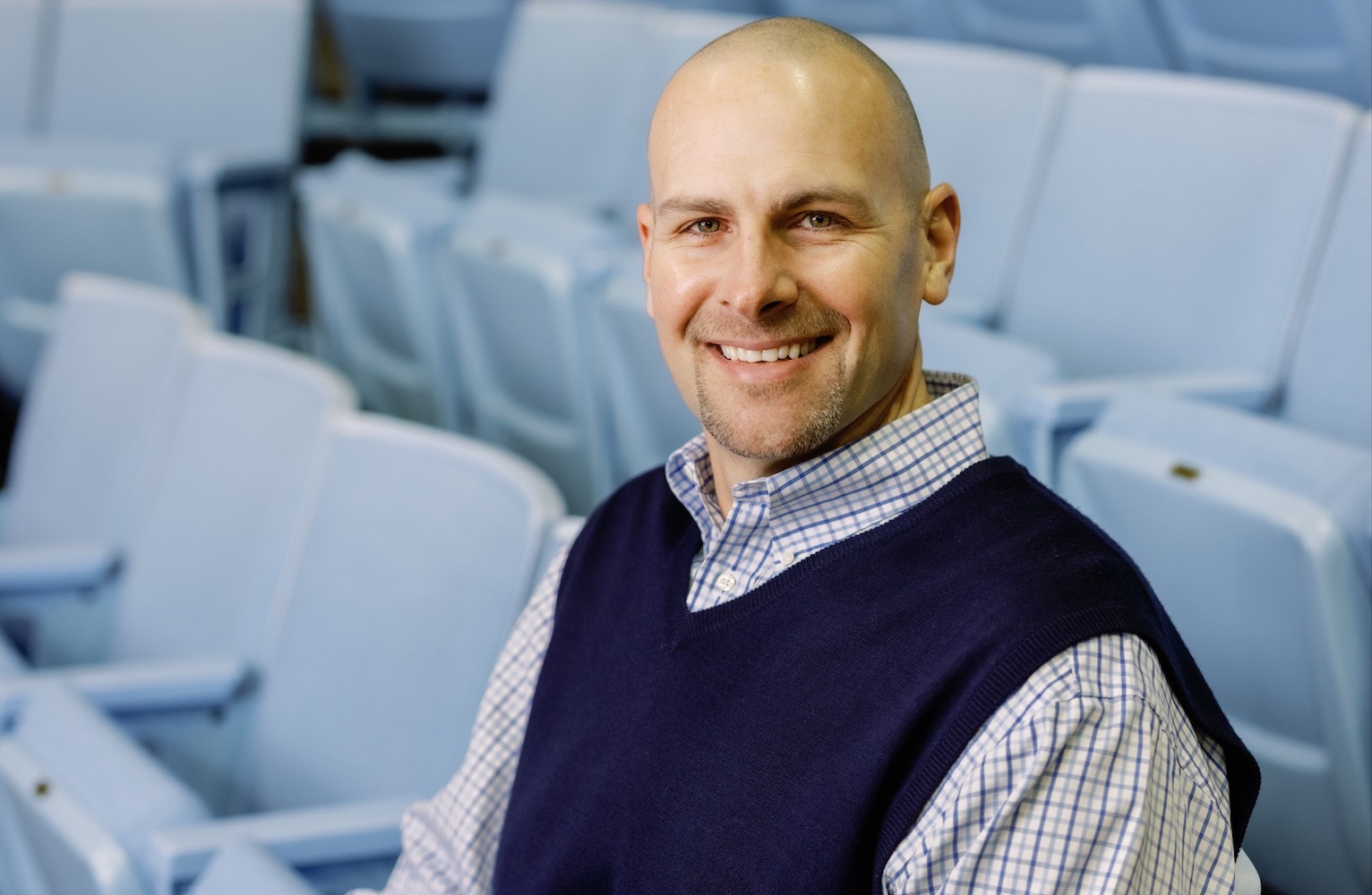 Eric Montross sits in the Dean E. Smith Center